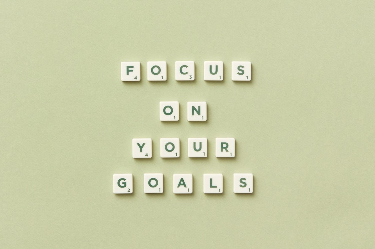 Scrabble tiles spelling out the words focus on your goals